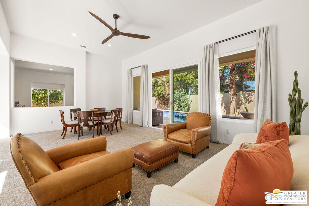 30 Vía Cielo Azul Palm Desert, CA 92260 - Photo 15 of 40 a living room with furniture and a large window