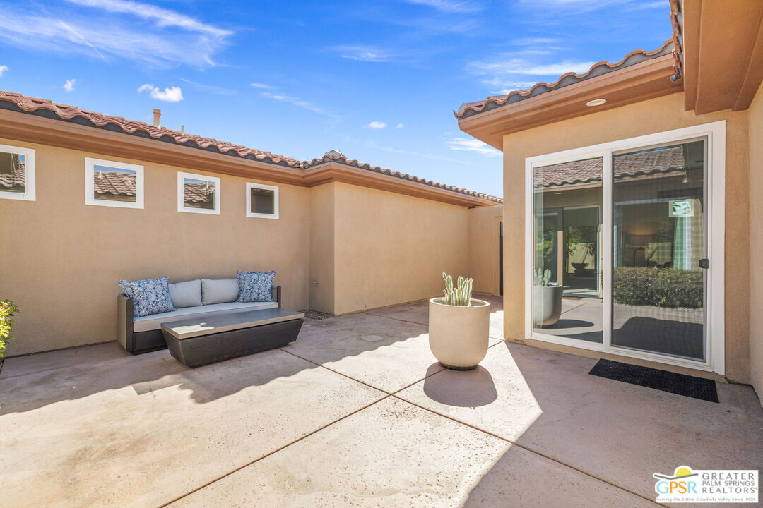 30 Vía Cielo Azul Palm Desert, CA 92260 - Photo 28 of 40 a view of a patio with couple of chairs and potted plants