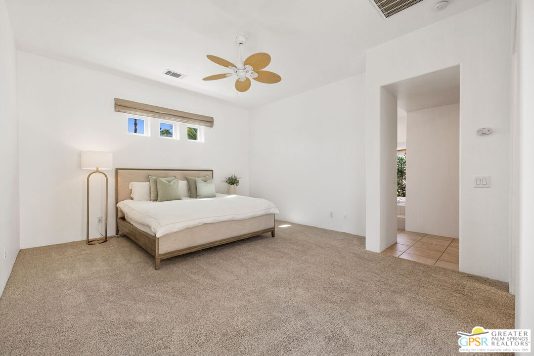 30 Vía Cielo Azul Palm Desert, CA 92260 - Photo 29 of 40 a bedroom with a bed and a painting on the wall