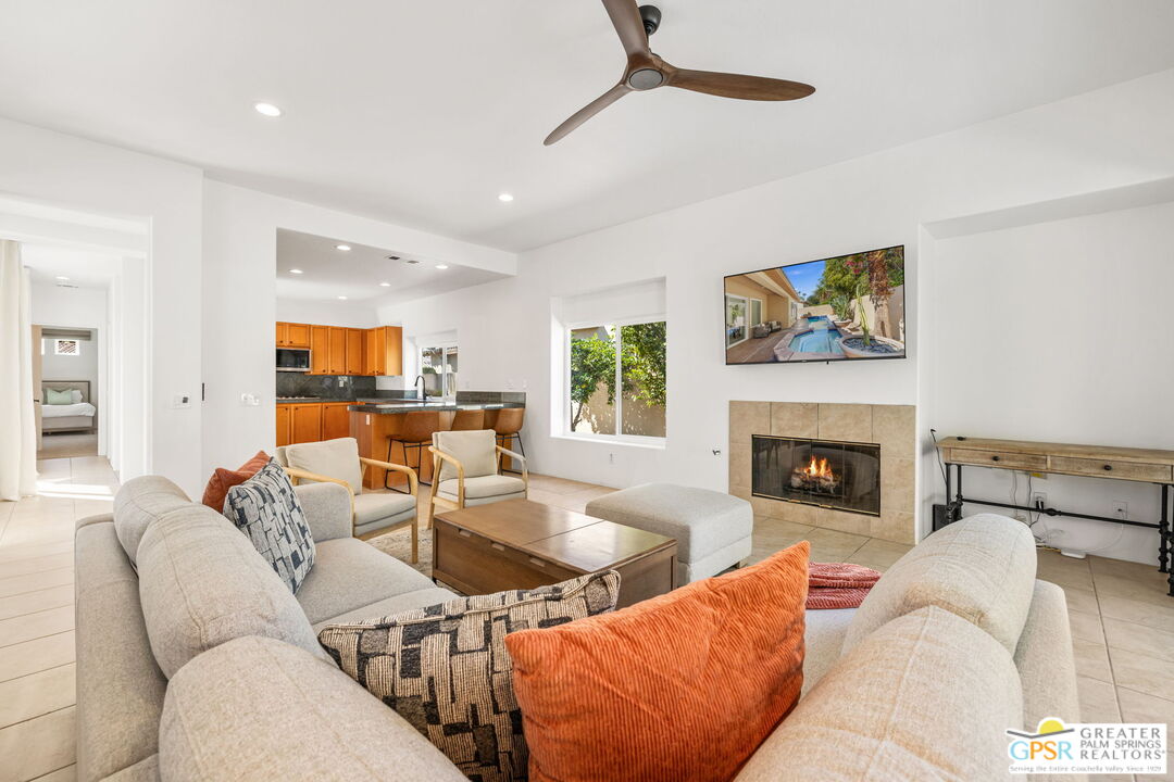 30 Vía Cielo Azul Palm Desert, CA 92260 - Photo 3 of 40 a living room with furniture and a fireplace