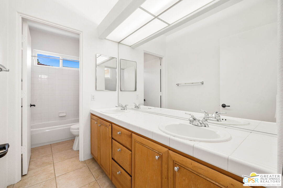 30 Vía Cielo Azul Palm Desert, CA 92260 - Photo 35 of 40 a bathroom with a sink a toilet and shower