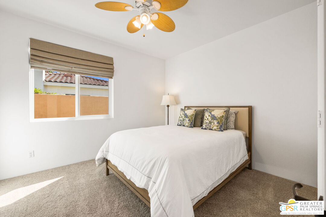 30 Vía Cielo Azul Palm Desert, CA 92260 - Photo 36 of 40 a bedroom with a bed and a window