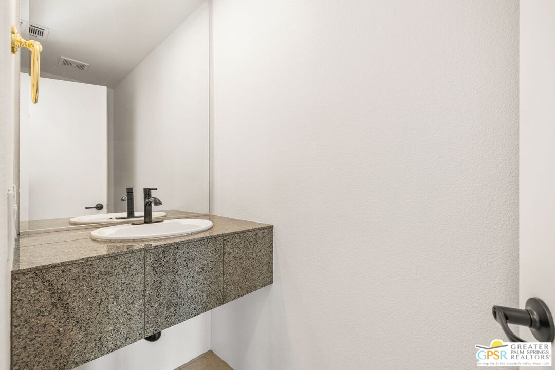 30 Vía Cielo Azul Palm Desert, CA 92260 - Photo 37 of 40 a bathroom with a sink and a mirror