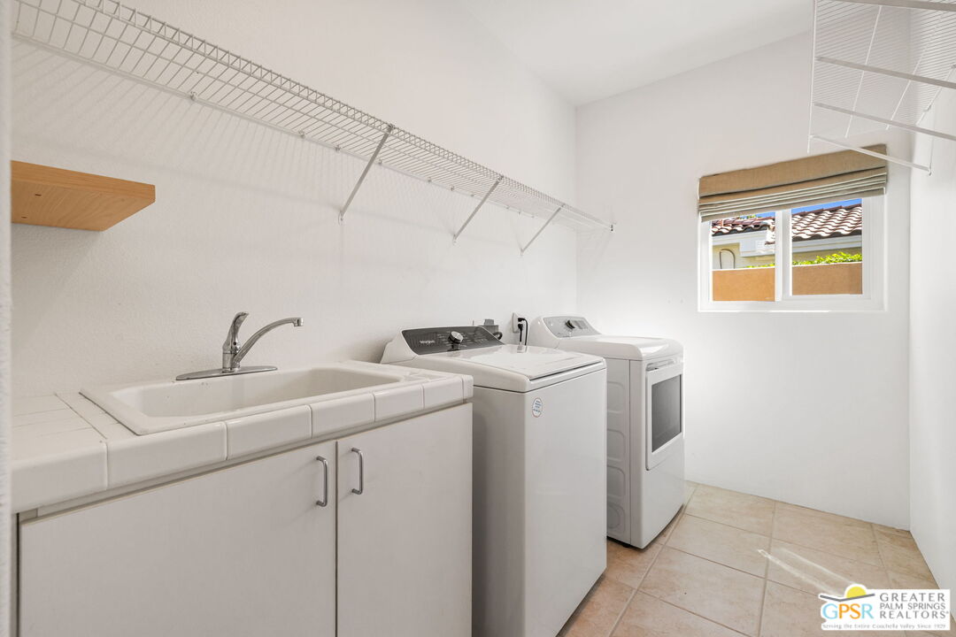 30 Vía Cielo Azul Palm Desert, CA 92260 - Photo 38 of 40 a utility room with dryer and washer