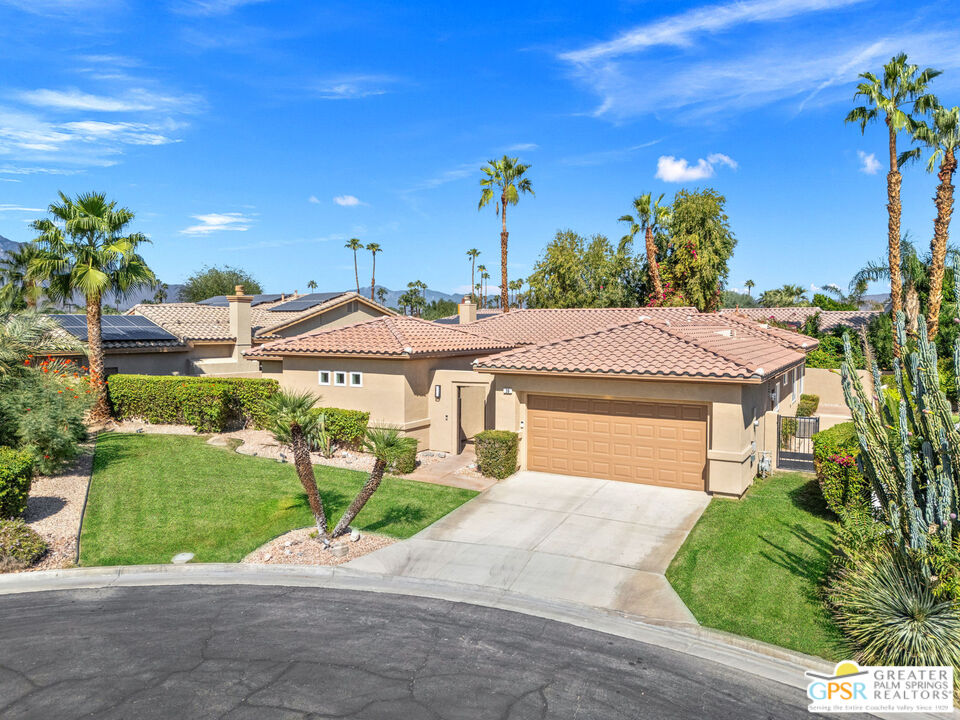 30 Vía Cielo Azul Palm Desert, CA 92260 - Photo 7 of 40 a front view of a house with a yard and potted plants