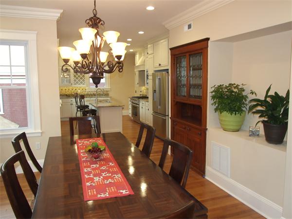 97 Perkins Street, Unit 2 Boston, MA 02130 - Photo 8 of 14 a view of a dining room with furniture a chandelier and wooden floor