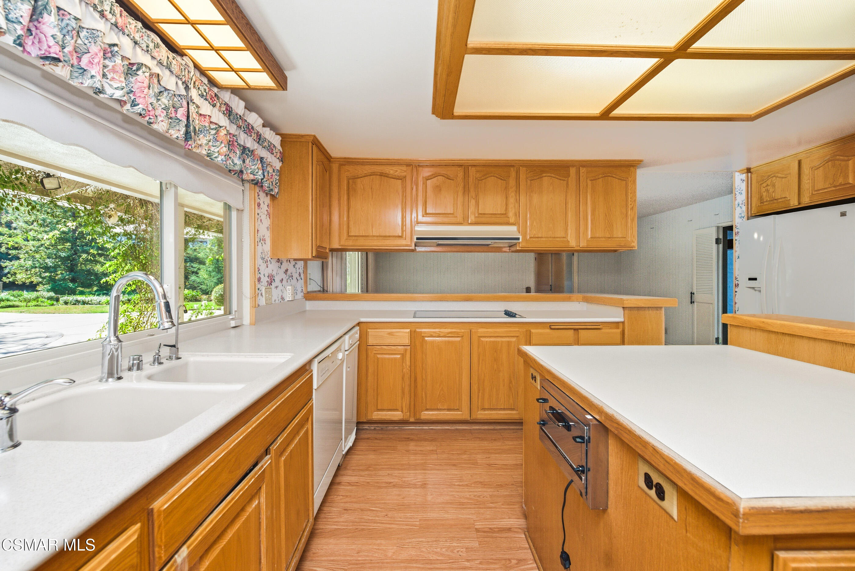 39 Inverness Road Thousand Oaks, CA 91361 - Photo 14 of 69 a kitchen with stainless steel appliances a sink window and cabinets
