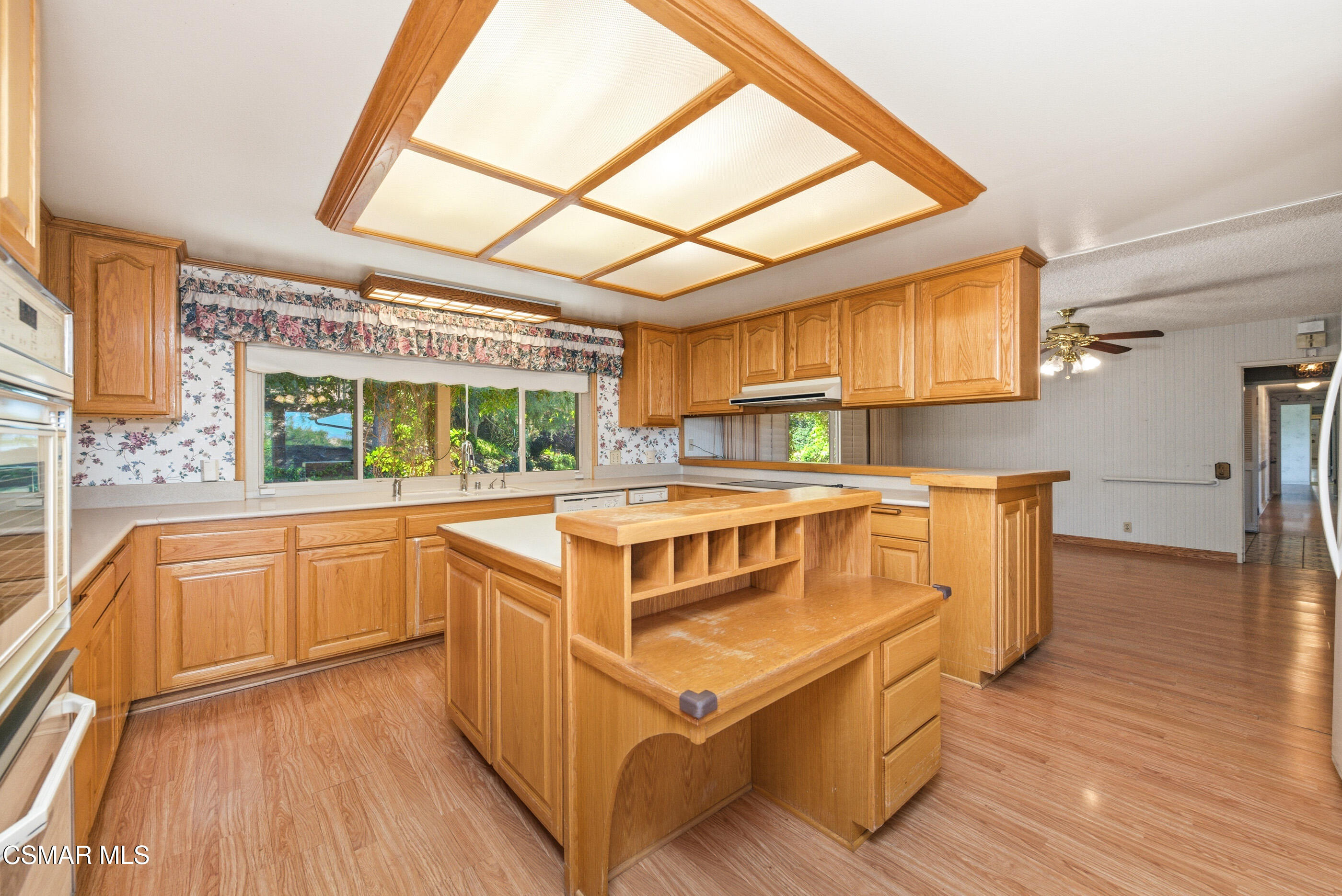 39 Inverness Road Thousand Oaks, CA 91361 - Photo 19 of 69 a kitchen with stainless steel appliances granite countertop a sink and wooden cabinets