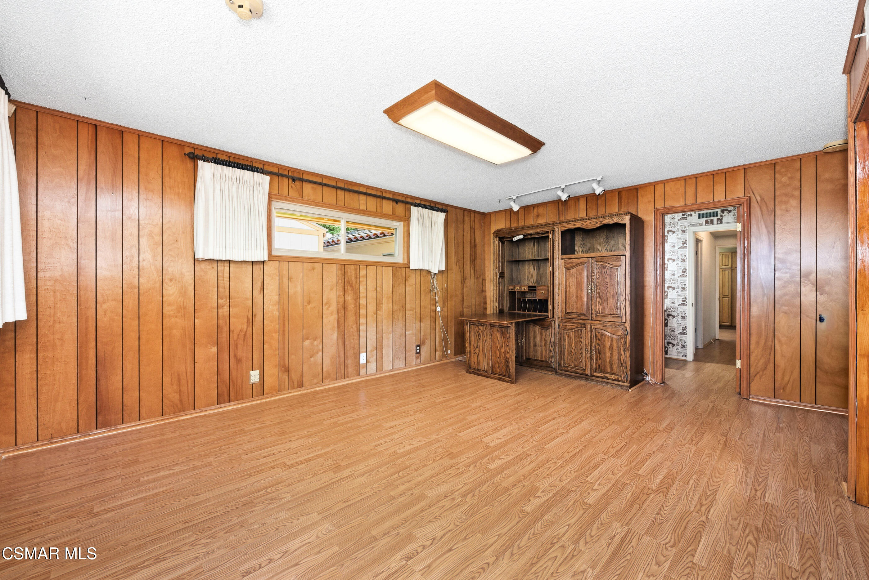 39 Inverness Road Thousand Oaks, CA 91361 - Photo 29 of 69 a view of an empty room with wooden floor and a window