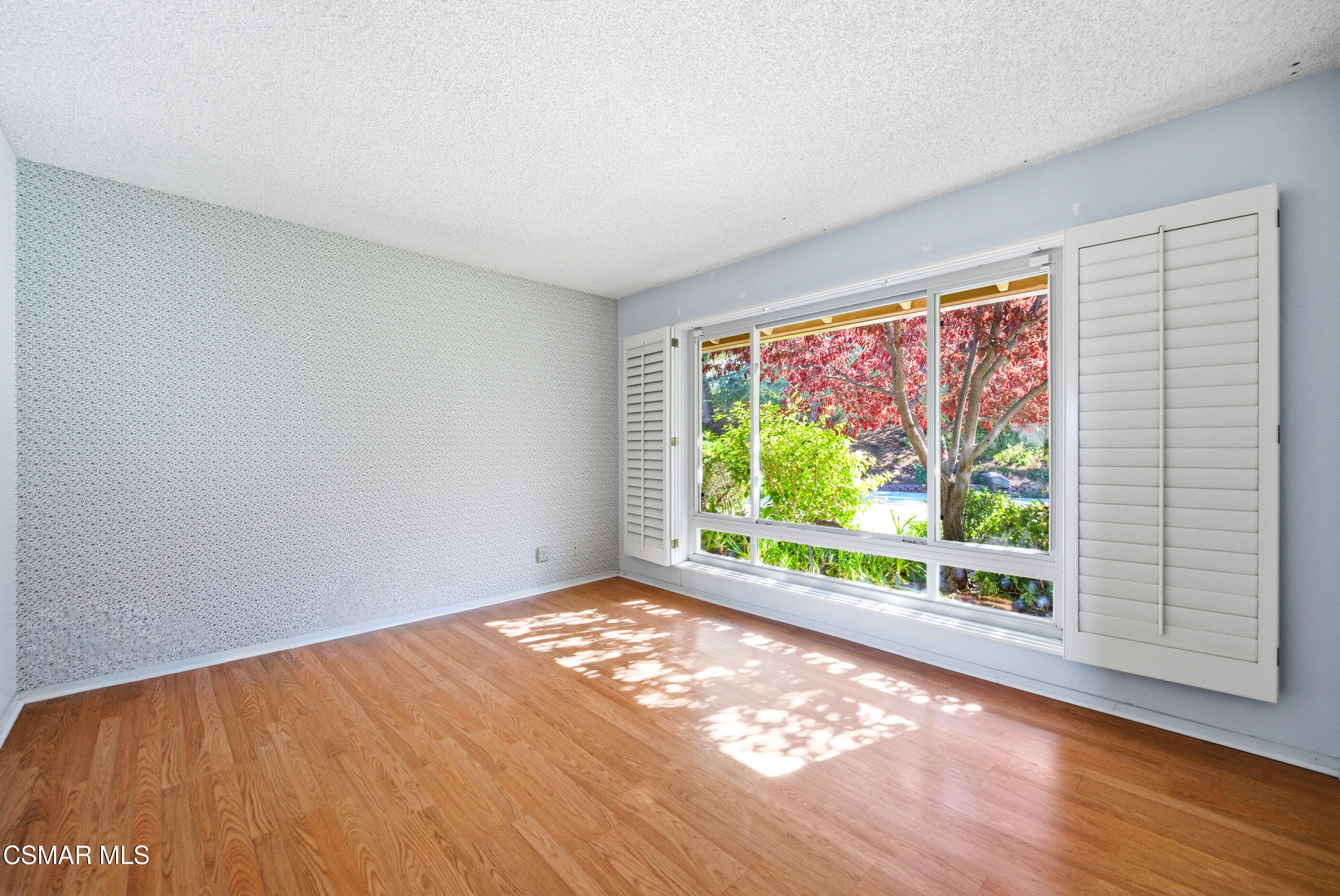 39 Inverness Road Thousand Oaks, CA 91361 - Photo 40 of 69 a view of an empty room with wooden floor and a window