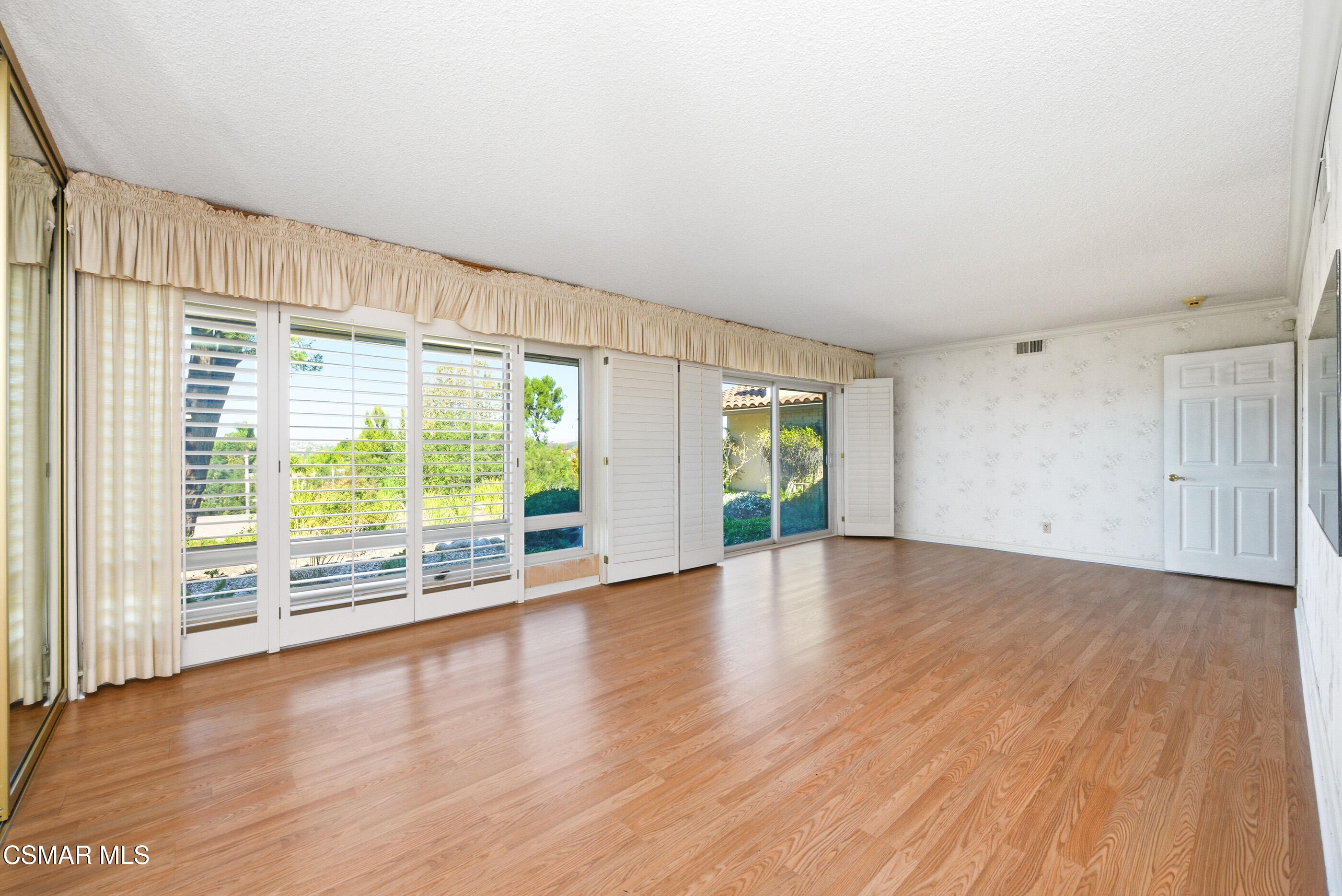 39 Inverness Road Thousand Oaks, CA 91361 - Photo 42 of 69 a view of an empty room with wooden floor and a window