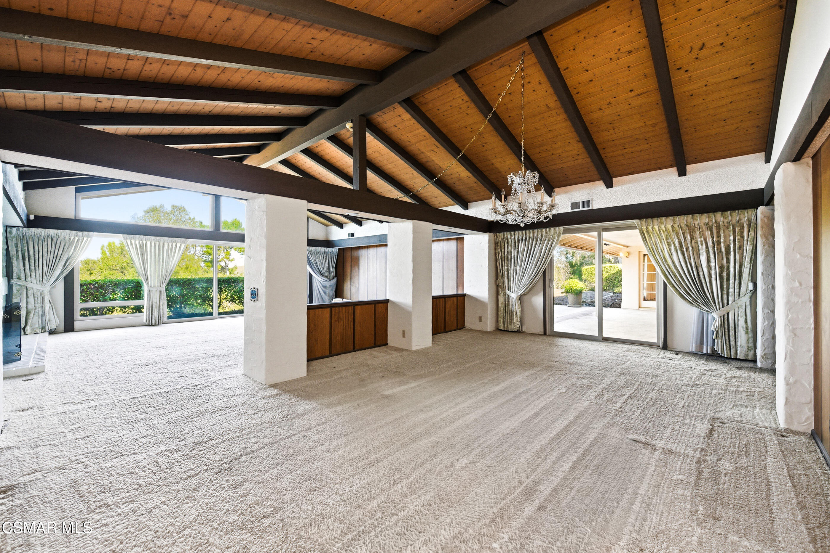 39 Inverness Road Thousand Oaks, CA 91361 - Photo 6 of 69 a view of an empty room with a fireplace and a large window