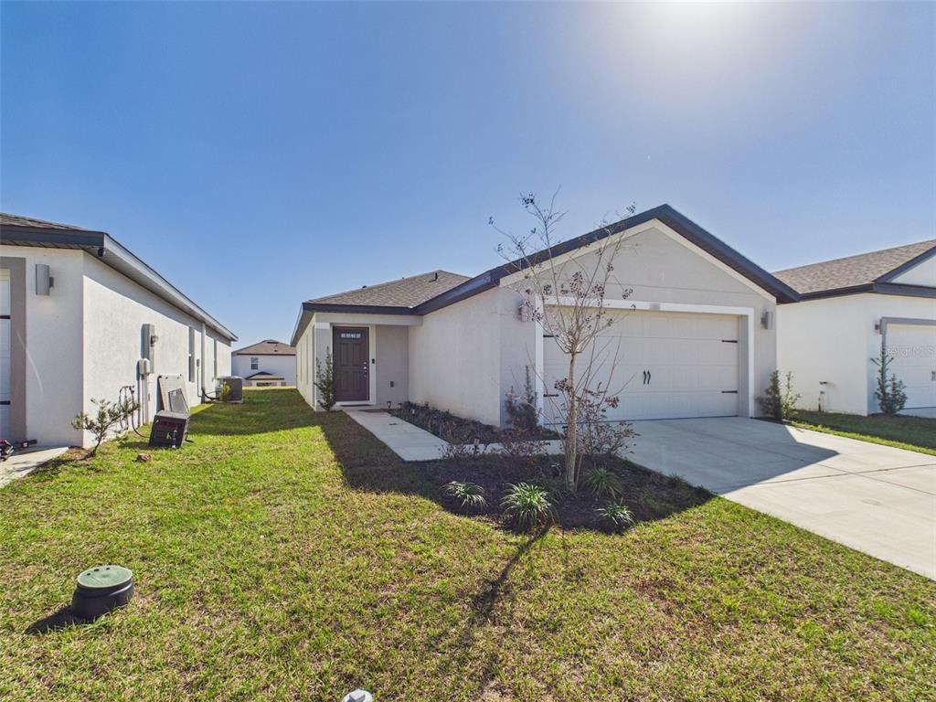 a front view of a house with garden