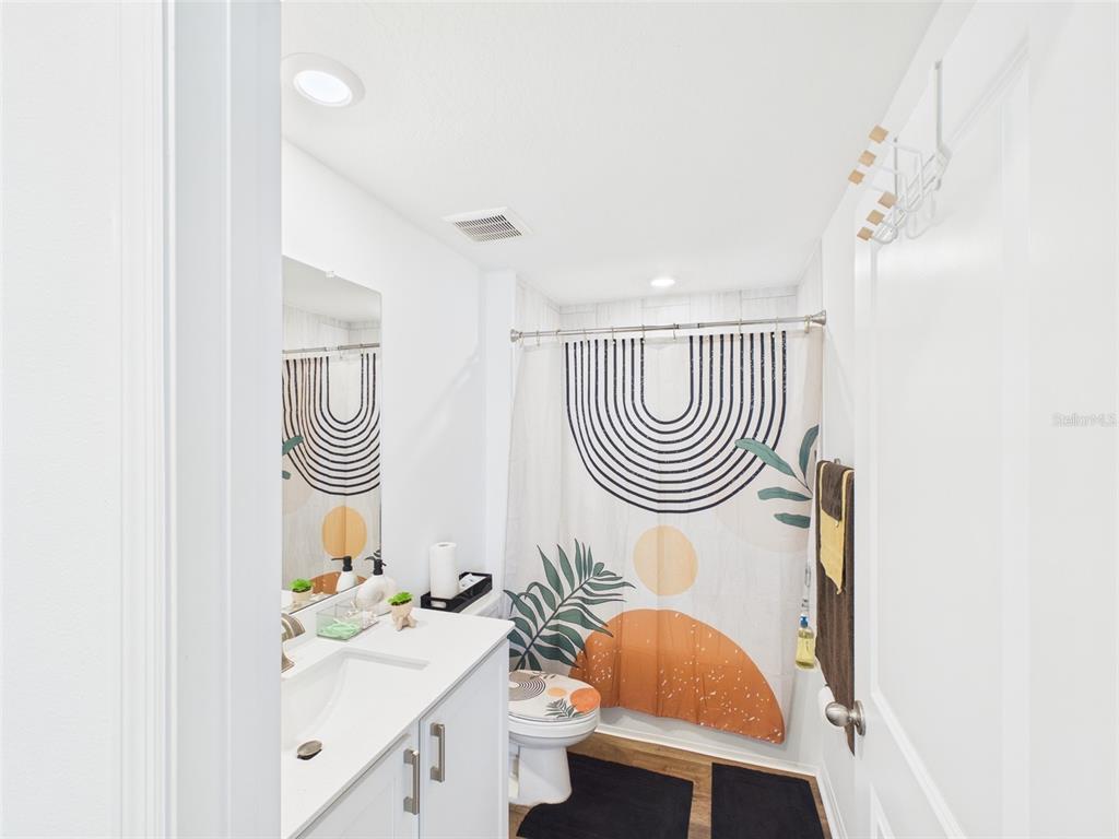 5194 Sailor Road Brooksville, FL 34602 - Photo 15 of 26 a bathroom with a sink a toilet and a mirror