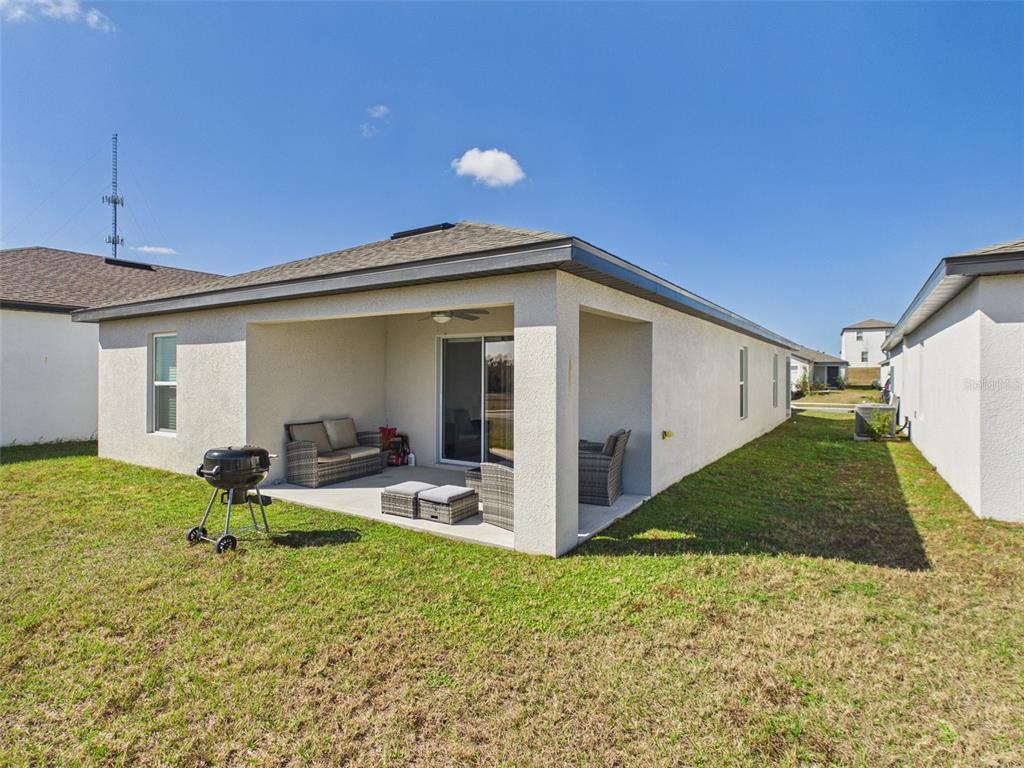 5194 Sailor Road Brooksville, FL 34602 - Photo 18 of 26 a view of a house with backyard and porch