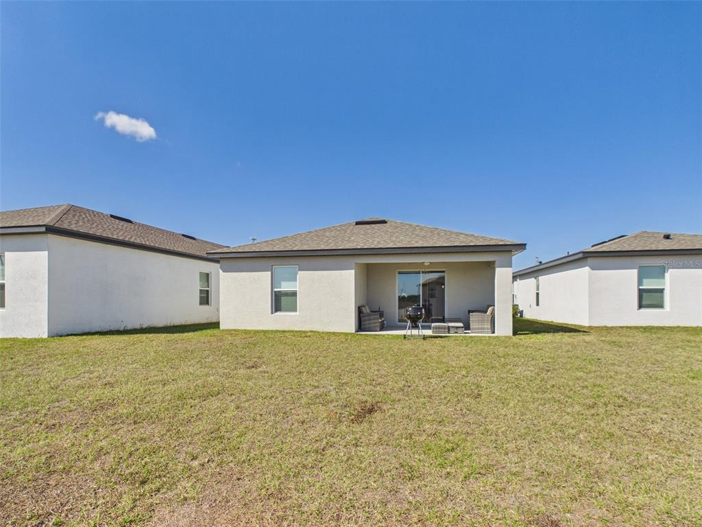 5194 Sailor Road Brooksville, FL 34602 - Photo 20 of 26 a view of a house with a yard