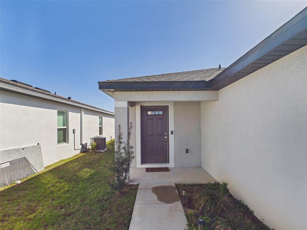 5194 Sailor Road Brooksville, FL 34602 - Photo 23 of 26 a view of a porch with a table and chairs