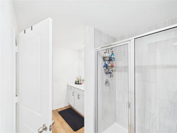 a bathroom with a shower and a sink