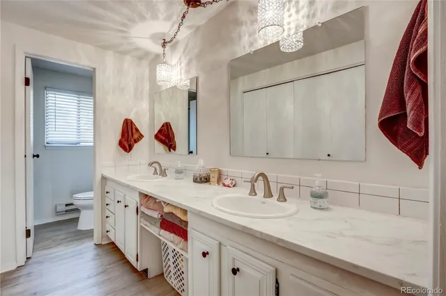 a bathroom with a sink a vanity and a mirror