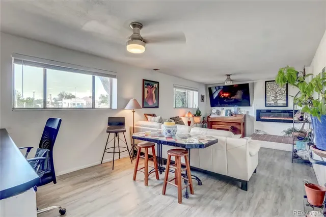 a view of a dining room with furniture window and wooden floor