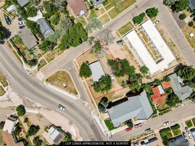 an aerial view of a house with a yard swimming pool and outdoor seating