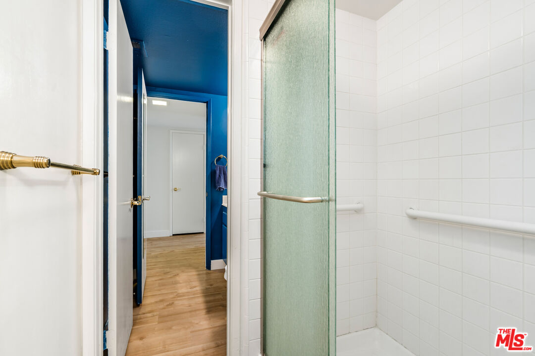 19547 Rinaldi Street, Unit 30 Porter Ranch, CA 91326 - Photo 11 of 33 a view of a bathroom from a hallway