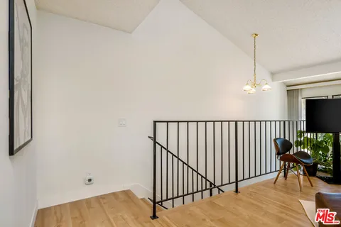 a view of a hallway with a chandelier