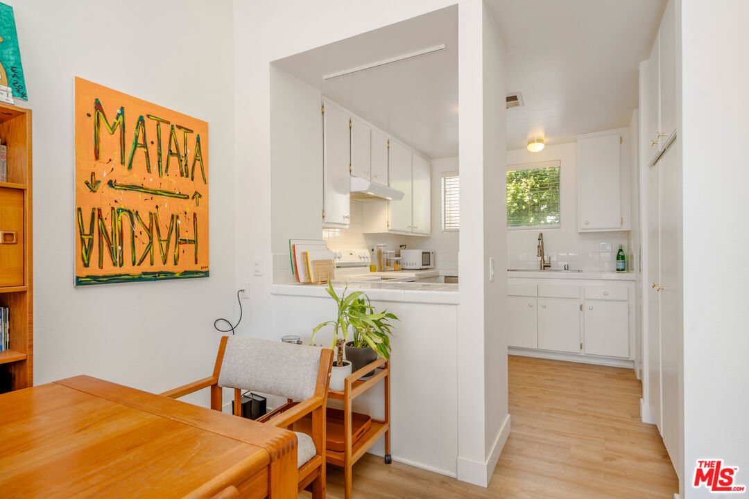 19547 Rinaldi Street, Unit 30 Porter Ranch, CA 91326 - Photo 19 of 33 a view of a kitchen and dining room