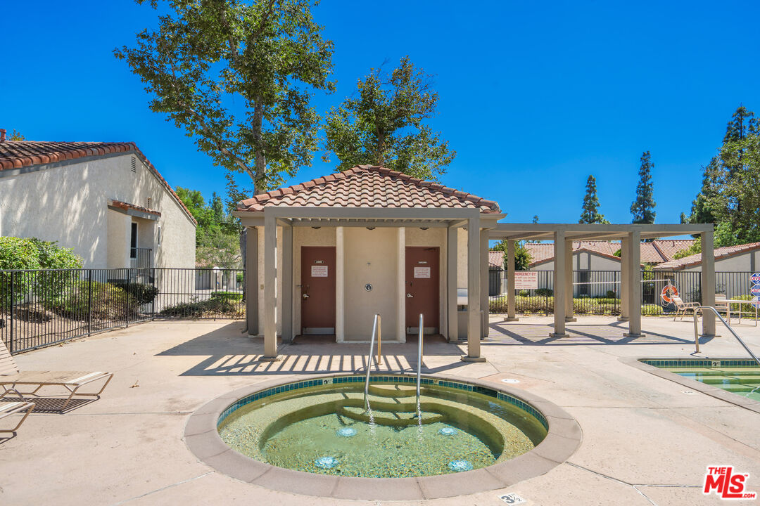 19547 Rinaldi Street, Unit 30 Porter Ranch, CA 91326 - Photo 32 of 33 a house view with a outdoor space