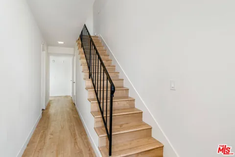 a view of a hallway with staircase