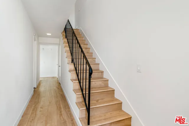 a view of a hallway with staircase