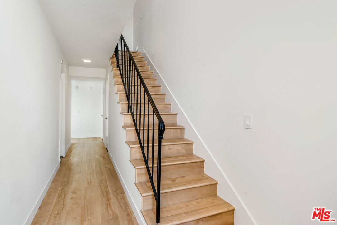 19547 Rinaldi Street, Unit 30 Porter Ranch, CA 91326 - Photo 4 of 33 a view of a hallway with staircase