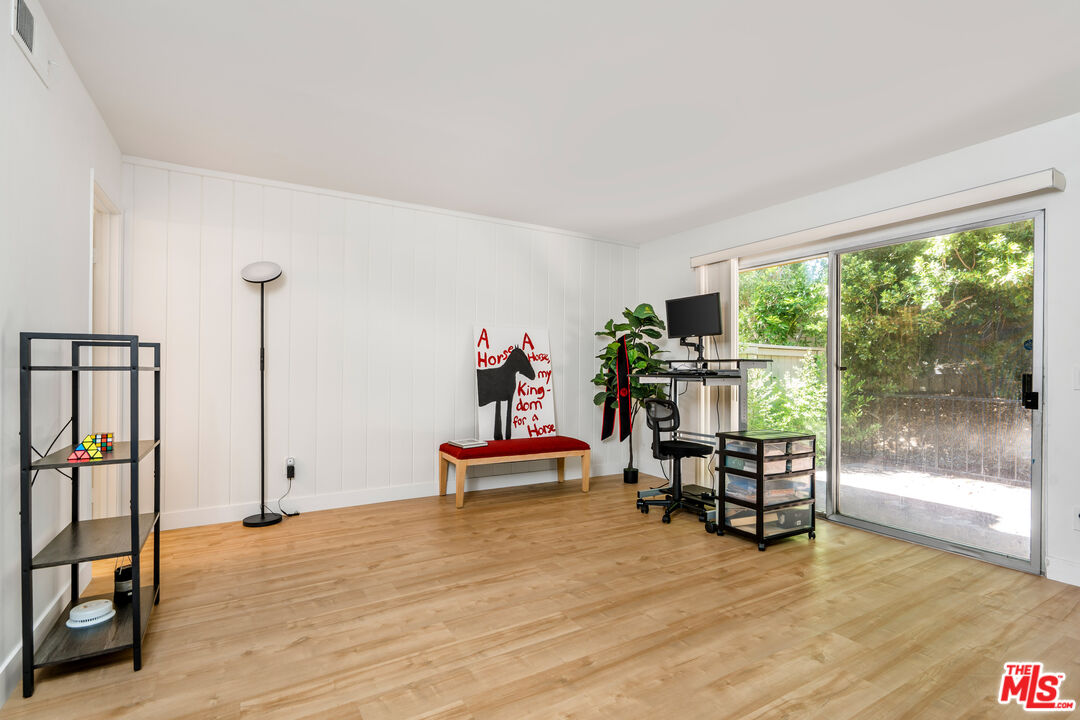 19547 Rinaldi Street, Unit 30 Porter Ranch, CA 91326 - Photo 5 of 33 a view of a room with wooden floor and furniture