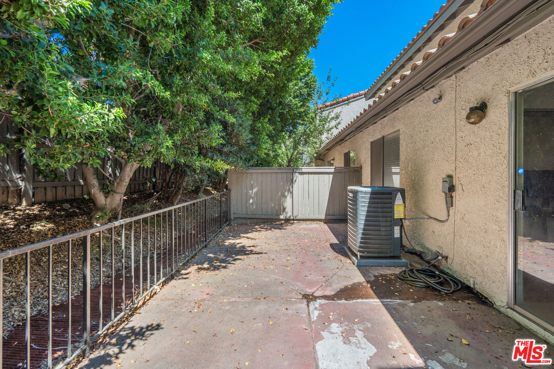 19547 Rinaldi Street, Unit 30 Porter Ranch, CA 91326 - Photo 6 of 33 a view of a house with a small yard