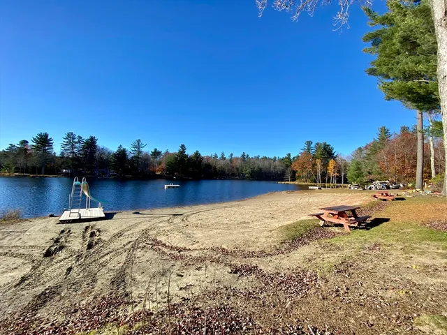 a view of a lake with a car parked in the background