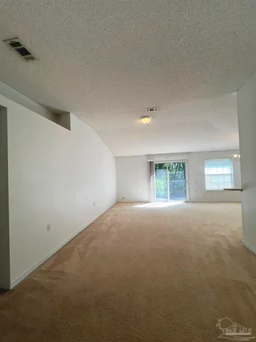a view of empty room with windows