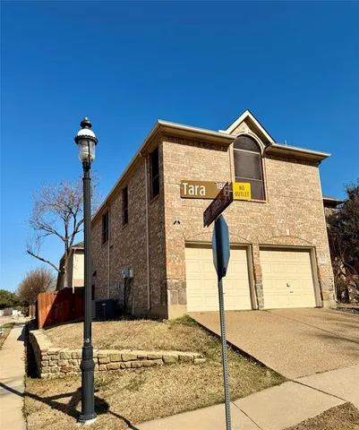 a front view of a house with parking