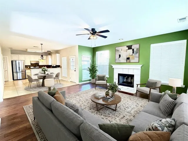 a living room with furniture and a fireplace