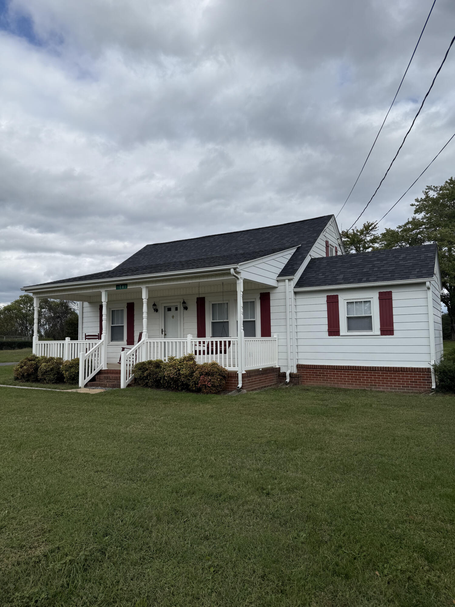 1081 East Gretna Road Gretna, VA 24557 - Photo 14 of 40 a front view of a house with a garden