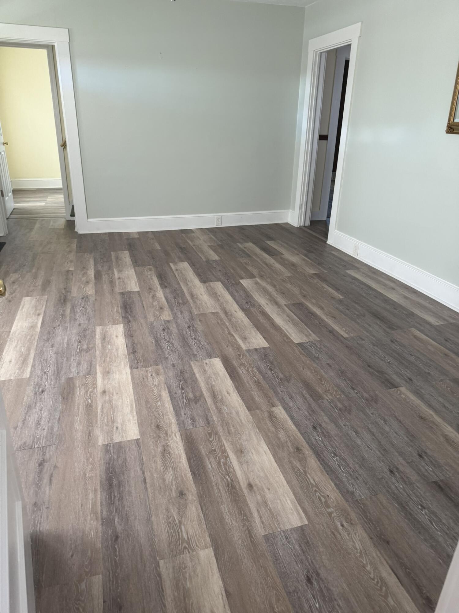 1081 East Gretna Road Gretna, VA 24557 - Photo 19 of 40 a view of an empty room with wooden floor and a window
