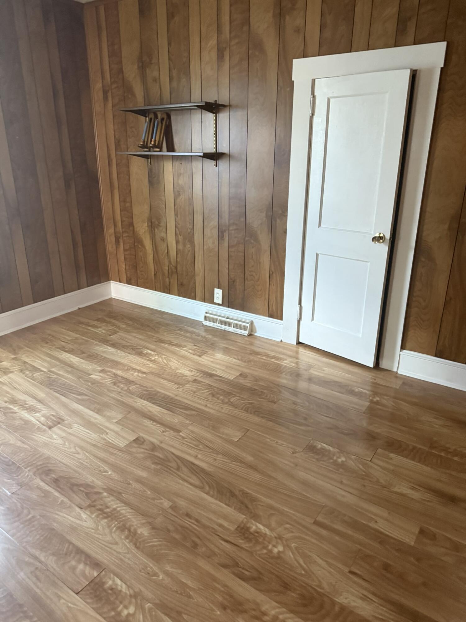 1081 East Gretna Road Gretna, VA 24557 - Photo 21 of 40 a view of an empty room with wooden floor and a mirror