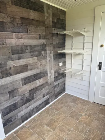 a view of walk in closet and bedroom