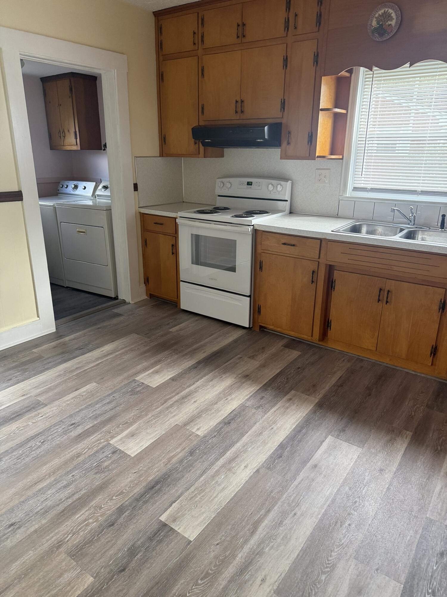 1081 East Gretna Road Gretna, VA 24557 - Photo 35 of 40 a kitchen with a sink cabinets and wooden floor