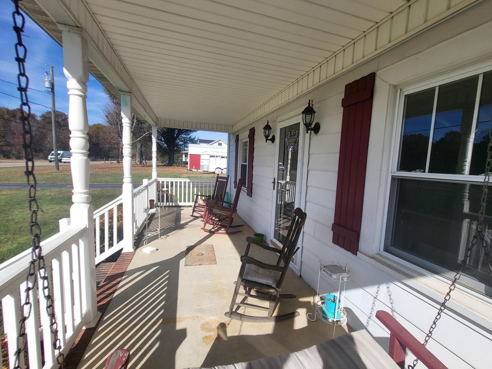 1081 East Gretna Road Gretna, VA 24557 - Photo 8 of 40 a view of a chairs and table in patio with a barbeque