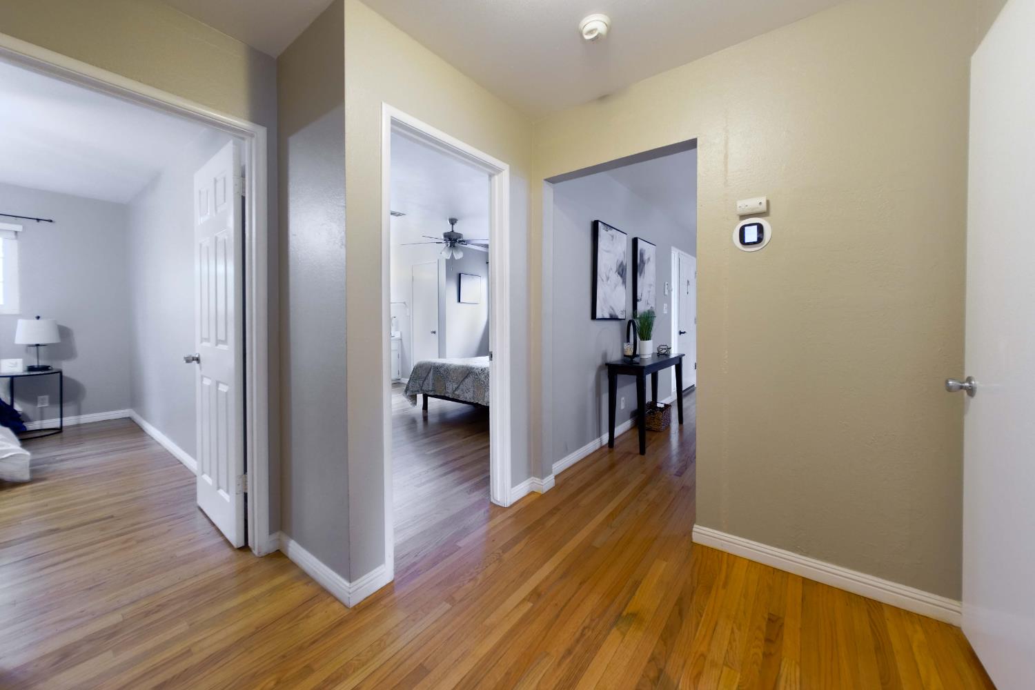 2952 Tahoe Drive Merced, CA 95340 - Photo 24 of 70 hall with light wood-style flooring and baseboards
