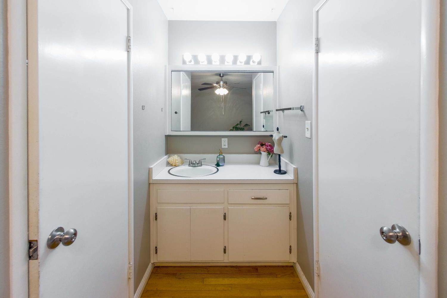 2952 Tahoe Drive Merced, CA 95340 - Photo 29 of 70 bathroom featuring vanity, light wood-type flooring, and a ceiling fan
