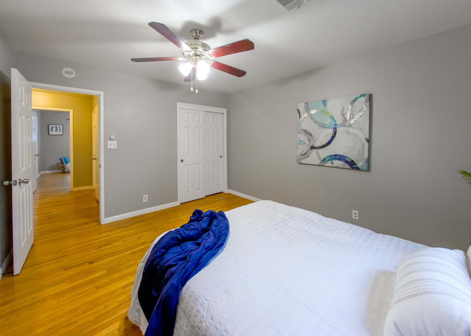 2952 Tahoe Drive Merced, CA 95340 - Photo 32 of 70 bedroom featuring light wood flooring, ceiling fan, and a closet