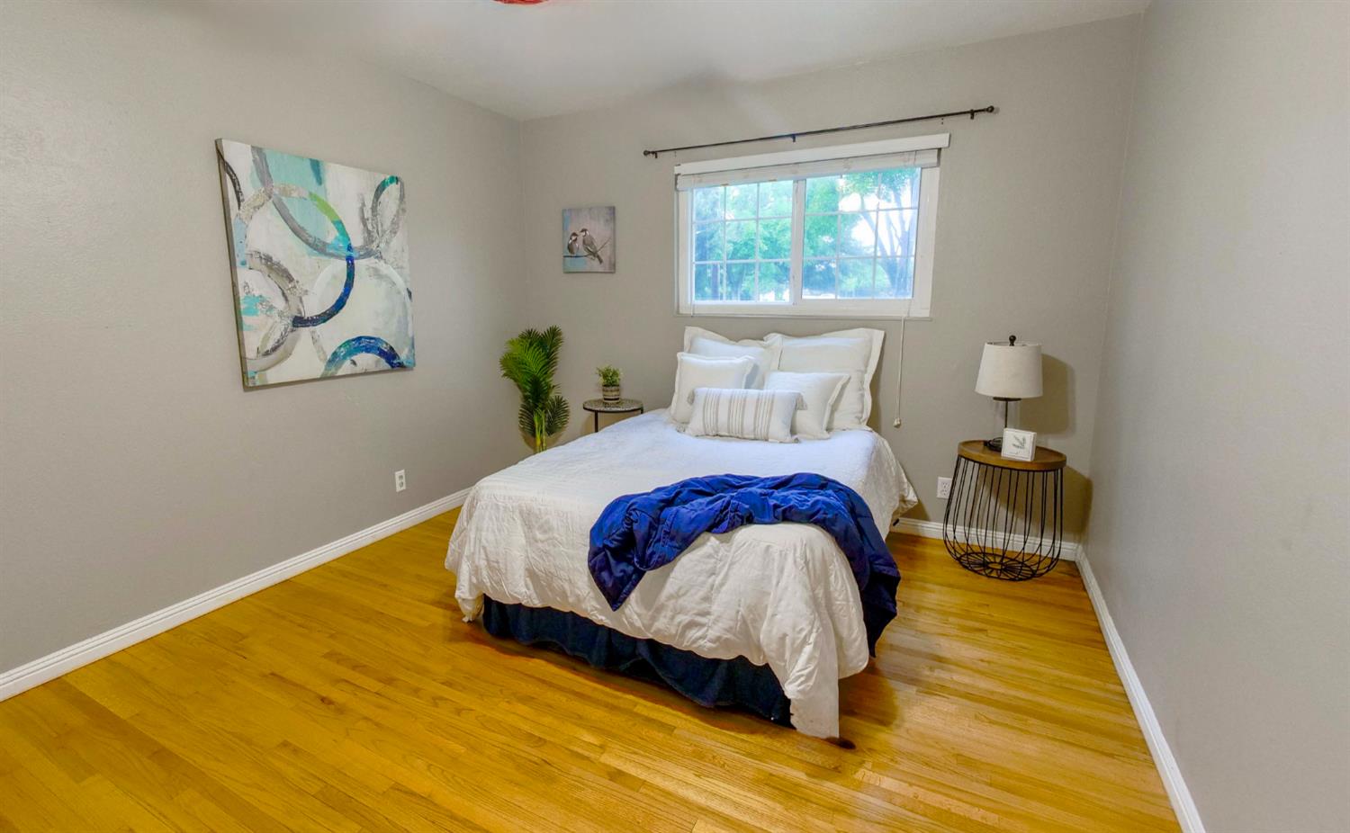 2952 Tahoe Drive Merced, CA 95340 - Photo 34 of 70 bedroom with light wood finished floors and baseboards
