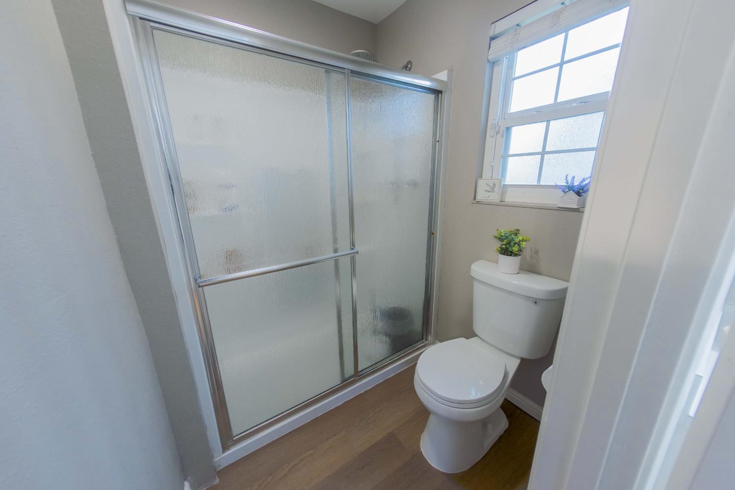 2952 Tahoe Drive Merced, CA 95340 - Photo 35 of 70 full bath featuring dark wood-style floors and a stall shower