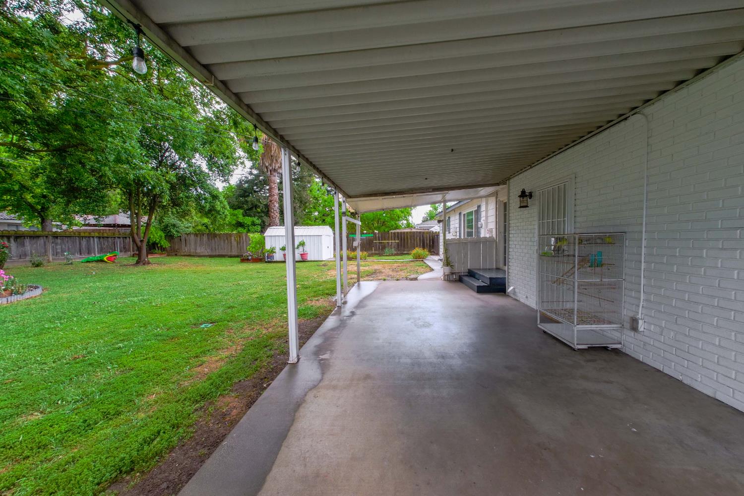 2952 Tahoe Drive Merced, CA 95340 - Photo 44 of 70 fenced backyard with a storage shed and a patio area